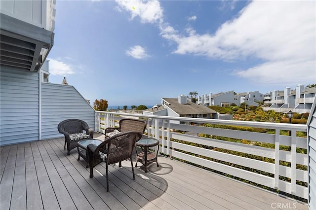 wooden deck featuring a residential view