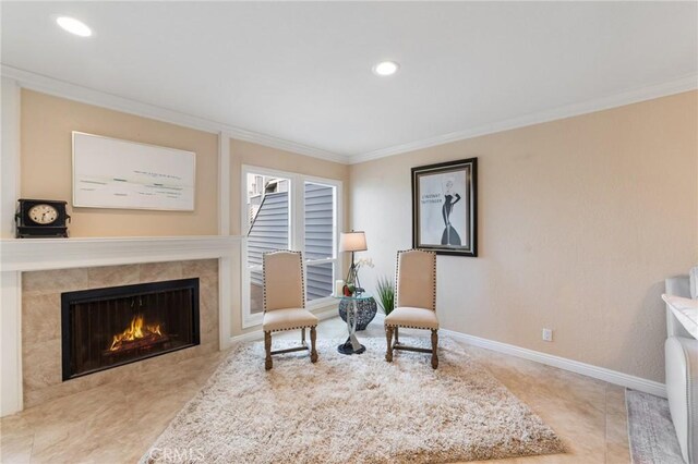 24612 Harbor View Dr Unit 55C, Dana Point, CA 92629 - sitting room featuring ornamental molding, a tiled fireplace, baseboards, and recessed lighting