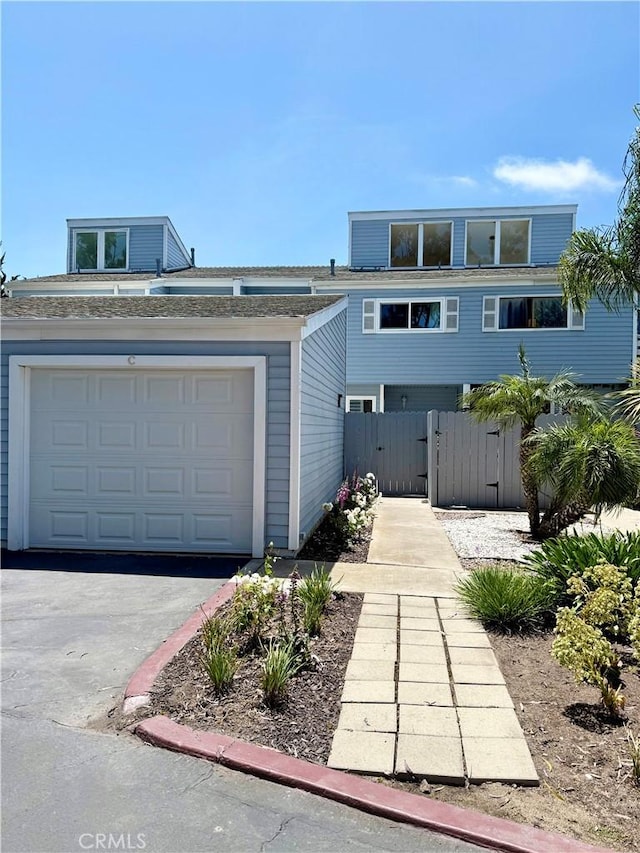24612 Harbor View Dr Unit 55C, Dana Point, CA 92629 - view of front facade with a gate, a garage, and driveway