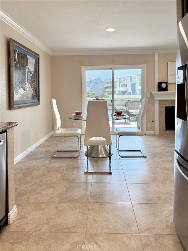 24612 Harbor View Dr Unit 55C, Dana Point, CA 92629 - dining room featuring ornamental molding, baseboards, a fireplace, and light tile patterned floors