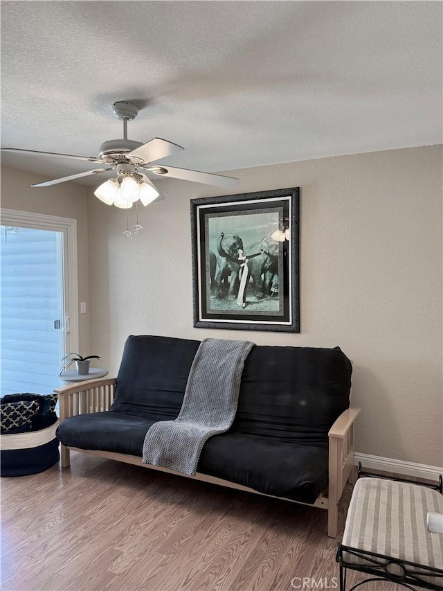 24612 Harbor View Dr Unit 55C, Dana Point, CA 92629 - living area with a textured ceiling, ceiling fan, wood finished floors, and baseboards