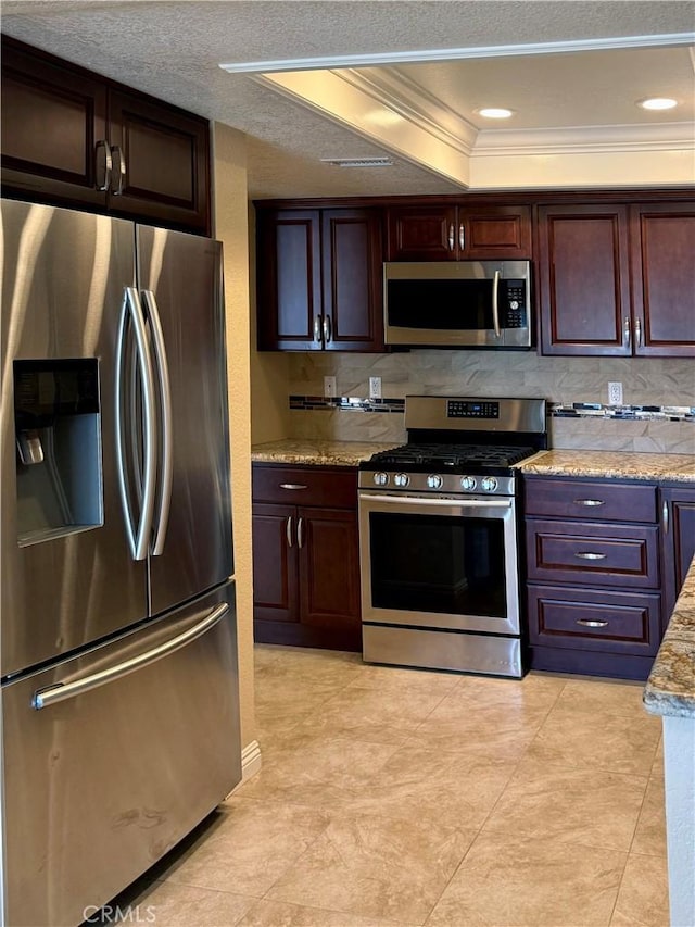24612 Harbor View Dr Unit 55C, Dana Point, CA 92629 - kitchen featuring appliances with stainless steel finishes, a tray ceiling, ornamental molding, backsplash, and dark brown cabinets