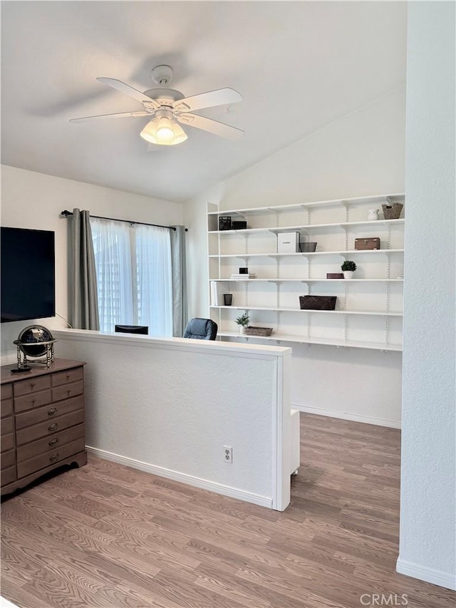 24612 Harbor View Dr Unit 55C, Dana Point, CA 92629 - bedroom with wood finished floors, vaulted ceiling, a ceiling fan, and baseboards