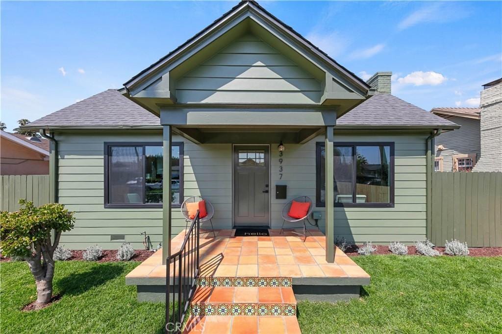 3937 2nd Ave, Los Angeles, CA 90008 - rear view of house with a shingled roof and a chimney