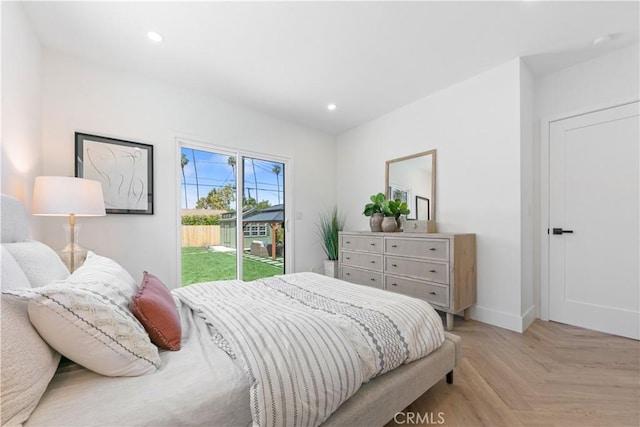 bedroom with access to outside, recessed lighting, and baseboards