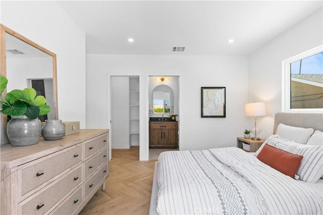 bedroom featuring visible vents, recessed lighting, and a spacious closet