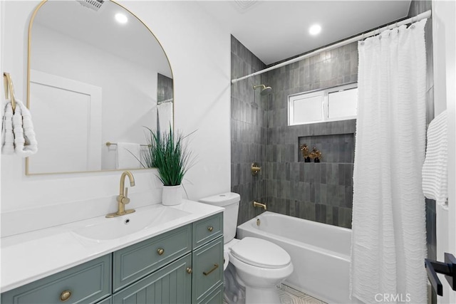 bathroom with vanity, visible vents, toilet, and shower / bath combination with curtain