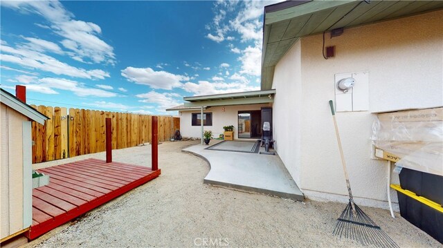 view of patio / terrace featuring fence