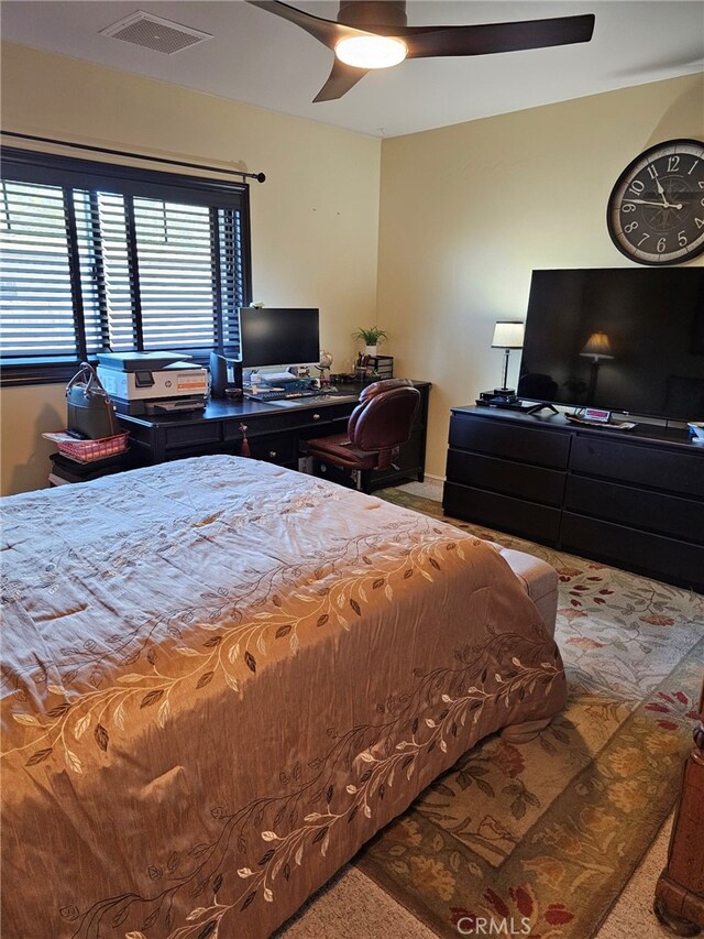 bedroom featuring visible vents and a ceiling fan