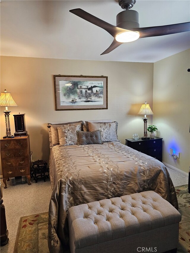 carpeted bedroom featuring a ceiling fan