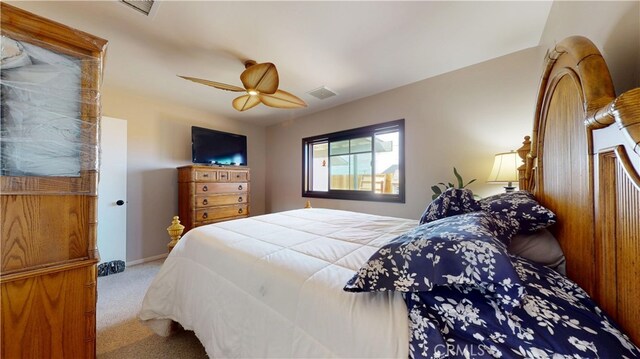 bedroom with baseboards, ceiling fan, carpet, and visible vents