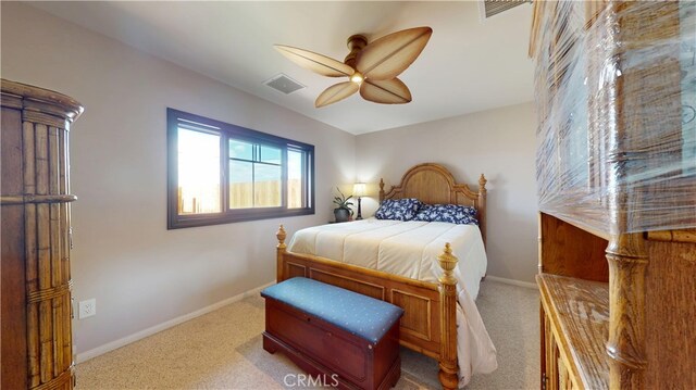 bedroom with carpet floors, baseboards, visible vents, and ceiling fan