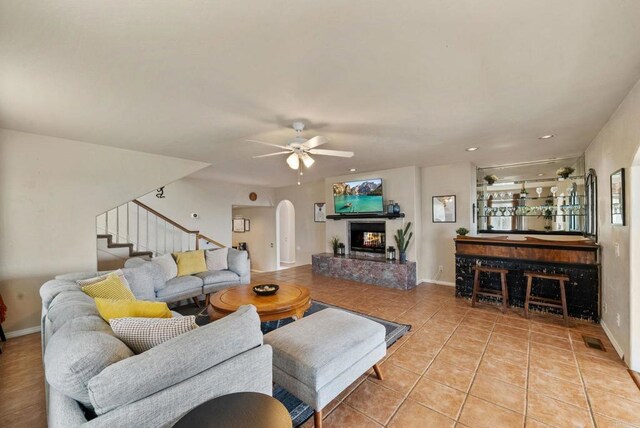 1994 Warmlands Ave, Vista, CA 92084 - tiled living room featuring arched walkways, stairs, ceiling fan, baseboards, and recessed lighting
