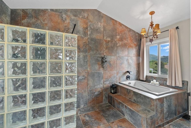 1994 Warmlands Ave, Vista, CA 92084 - bathroom with vaulted ceiling, a walk in shower, a bath, a chandelier, and tile walls