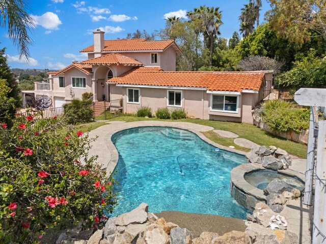 1994 Warmlands Ave, Vista, CA 92084 - view of swimming pool featuring fence and a pool with connected hot tub