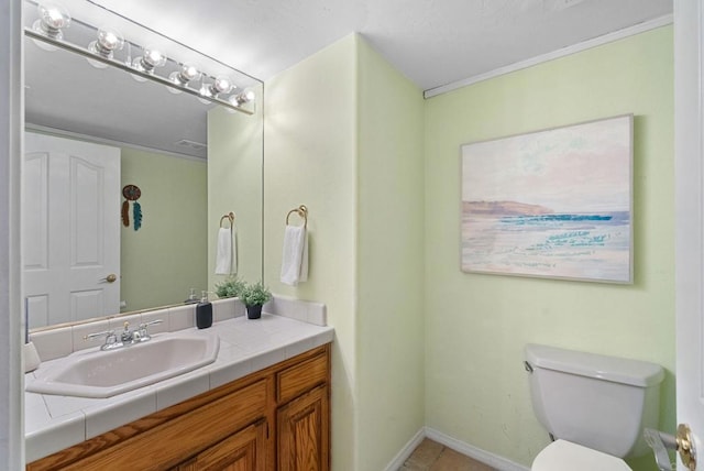 1994 Warmlands Ave, Vista, CA 92084 - bathroom featuring toilet, vanity, tile patterned floors, and baseboards