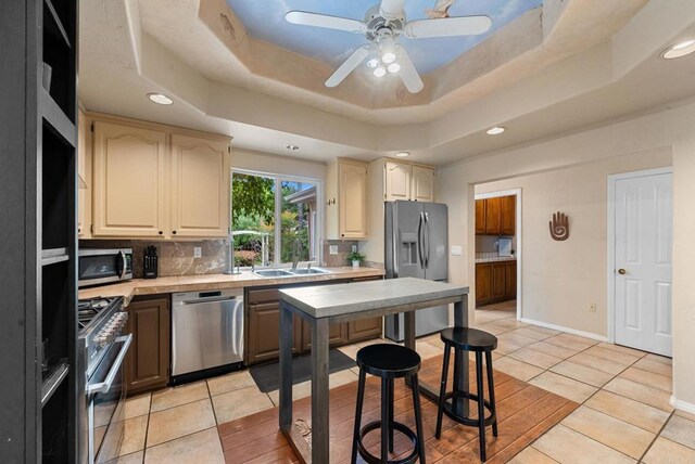 1994 Warmlands Ave, Vista, CA 92084 - kitchen with stainless steel appliances, a sink, light countertops, light tile patterned flooring, and recessed lighting