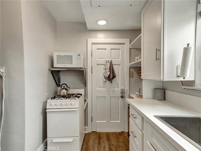 16855 12th St, Sunset Beach, CA 90742 - laundry area featuring dark wood-style floors and a sink