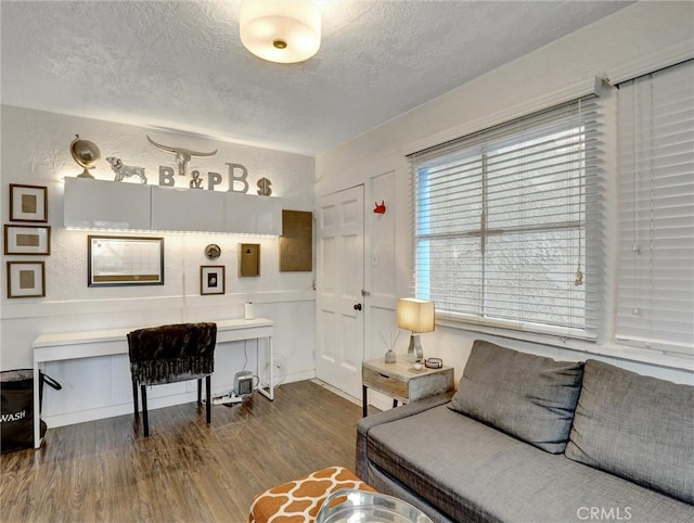 16855 12th St, Sunset Beach, CA 90742 - living area featuring a textured ceiling and dark wood-style flooring