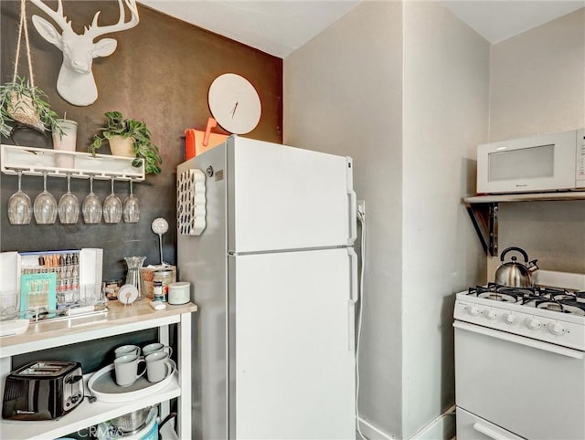 16855 12th St, Sunset Beach, CA 90742 - kitchen featuring white appliances and open shelves
