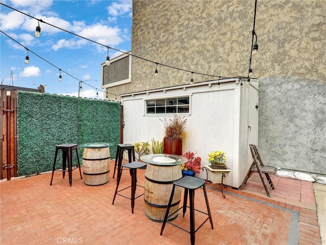 16855 12th St, Sunset Beach, CA 90742 - view of patio / terrace featuring a fenced backyard and outdoor dining space