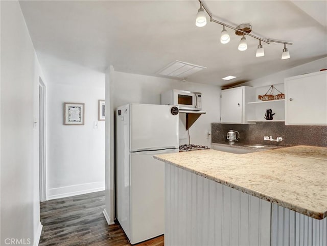 16855 12th St, Sunset Beach, CA 90742 - kitchen with white appliances, open shelves, white cabinets, dark wood-style floors, and baseboards