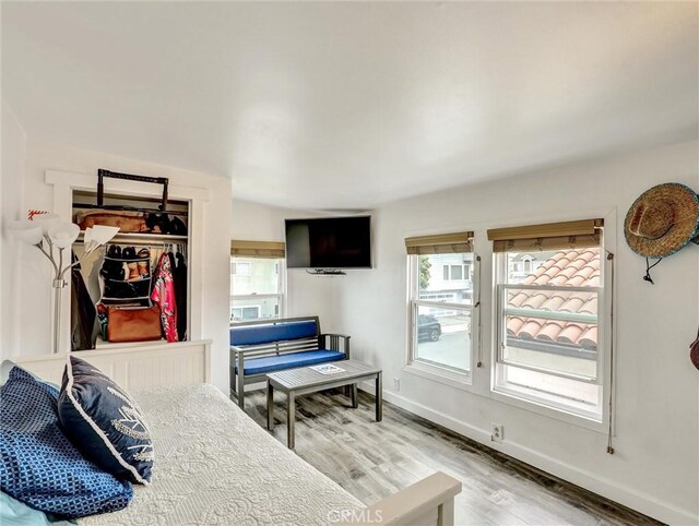 16855 12th St, Sunset Beach, CA 90742 - bedroom featuring light wood-type flooring and baseboards