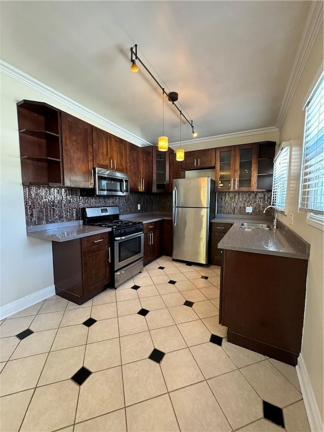 kitchen with open shelves, appliances with stainless steel finishes, dark brown cabinetry, a sink, and backsplash