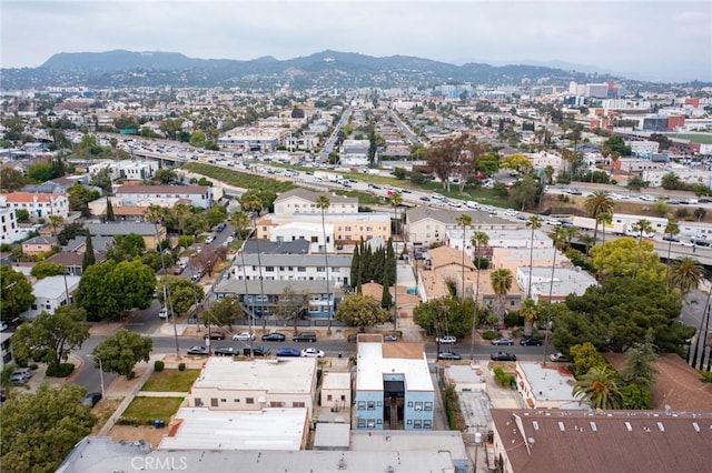 birds eye view of property with a mountain view