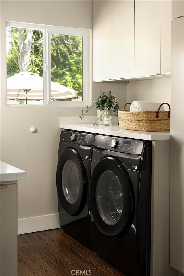 3420 Lifur Ave, Los Angeles, CA 90032 - laundry room with cabinet space, washing machine and clothes dryer, baseboards, and dark wood finished floors