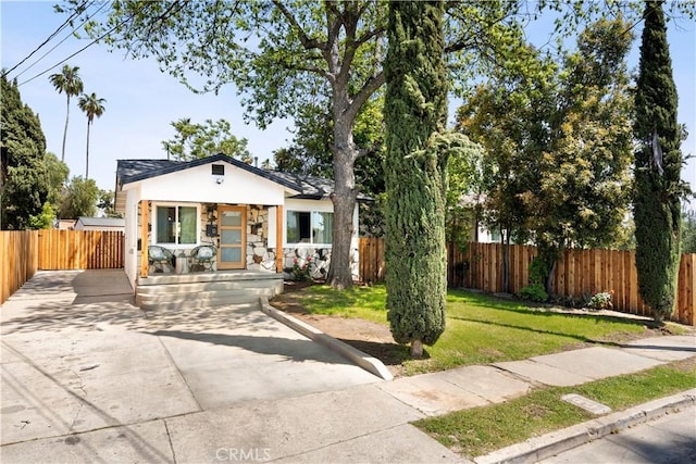 3420 Lifur Ave, Los Angeles, CA 90032 - bungalow with a porch, stucco siding, and driveway