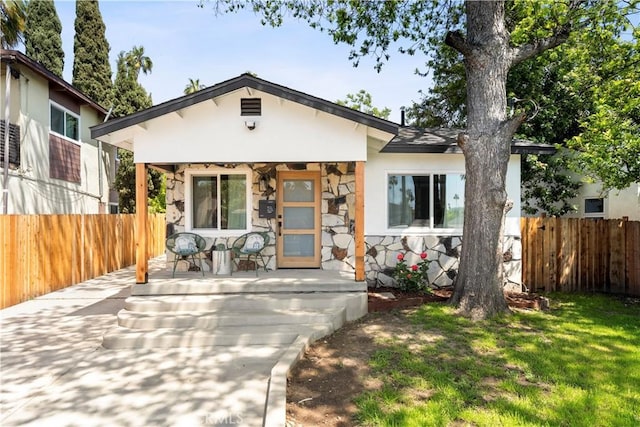 3420 Lifur Ave, Los Angeles, CA 90032 - bungalow featuring stone siding, covered porch, and stucco siding