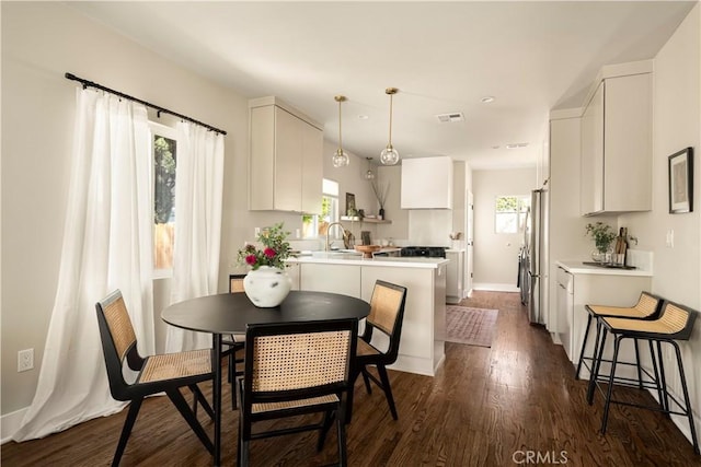 3420 Lifur Ave, Los Angeles, CA 90032 - dining area featuring dark wood-type flooring, baseboards, and recessed lighting