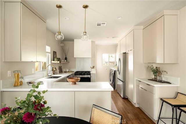 3420 Lifur Ave, Los Angeles, CA 90032 - kitchen with gas stove, a sink, a peninsula, light countertops, and freestanding refrigerator