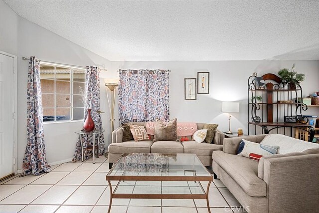 875 S Rexford St, Rialto, CA 92376 - living area with a textured ceiling, light tile patterned floors, vaulted ceiling, and baseboards