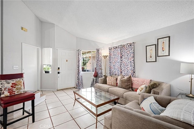 875 S Rexford St, Rialto, CA 92376 - living area featuring a textured ceiling, vaulted ceiling, and light tile patterned floors