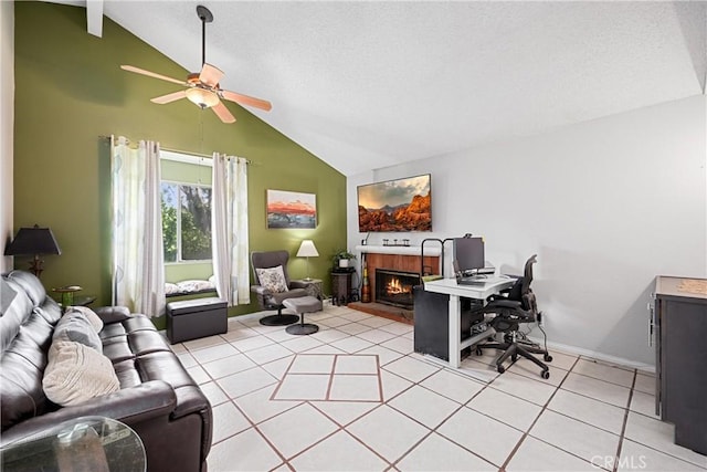 875 S Rexford St, Rialto, CA 92376 - home office with a lit fireplace, a ceiling fan, light tile patterned floors, baseboards, and high vaulted ceiling