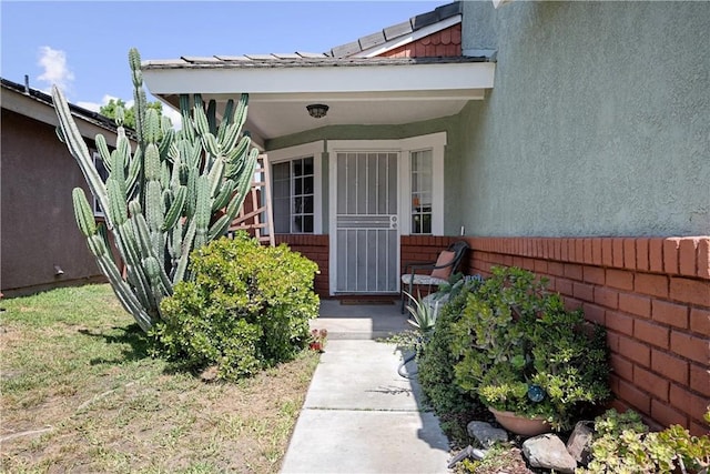875 S Rexford St, Rialto, CA 92376 - doorway to property featuring stucco siding