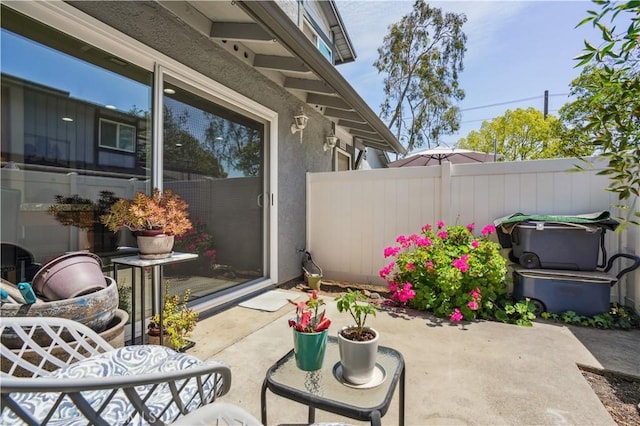view of patio featuring fence