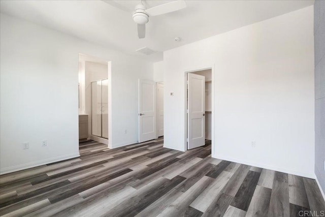 1524 Redbud Way, Oceanside, CA 92056 - unfurnished bedroom with baseboards, a walk in closet, and wood finished floors