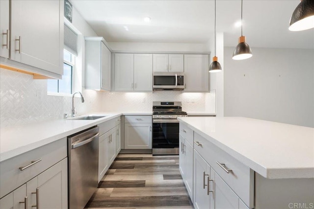 1524 Redbud Way, Oceanside, CA 92056 - kitchen with decorative backsplash, a sink, light countertops, stainless steel appliances, and light wood-style flooring
