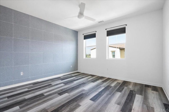 1524 Redbud Way, Oceanside, CA 92056 - empty room with a ceiling fan, visible vents, and dark wood finished floors