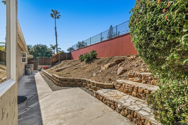 view of yard with fence and a patio area