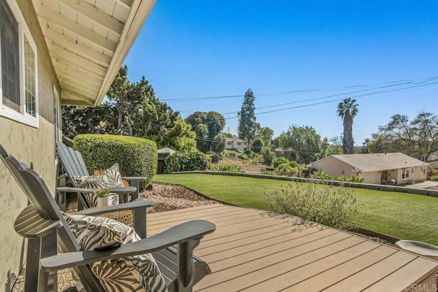 wooden deck with a lawn