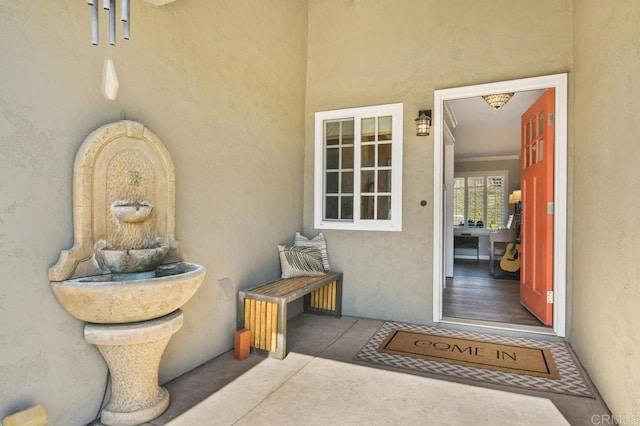 doorway to property with stucco siding
