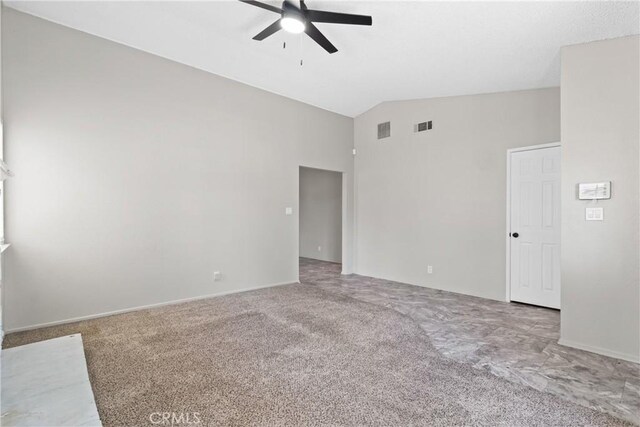 spare room with a ceiling fan, visible vents, and carpet