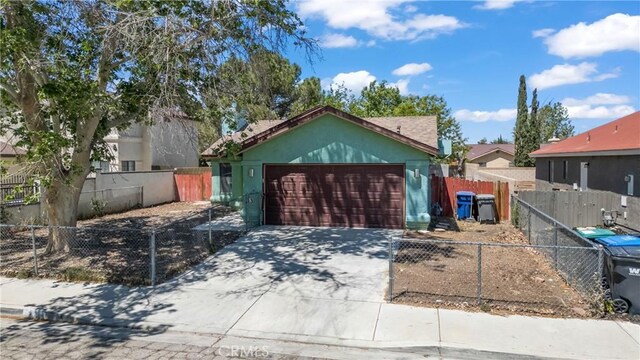 exterior space with fence and driveway