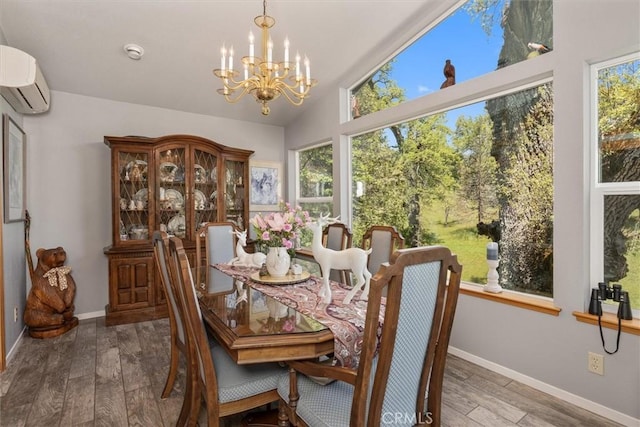 36556 Mudge Ranch Rd, Coarsegold, CA 93614 - dining room with an inviting chandelier, an AC wall unit, baseboards, wood finished floors, and vaulted ceiling