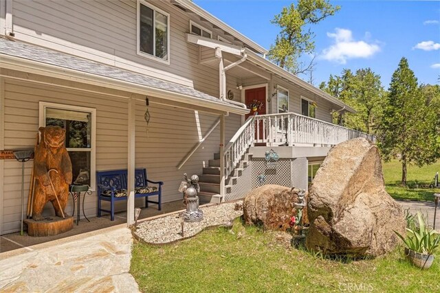 36556 Mudge Ranch Rd, Coarsegold, CA 93614 - view of front of home featuring a wooden deck and stairs