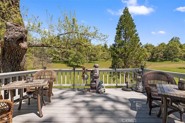 36556 Mudge Ranch Rd, Coarsegold, CA 93614 - wooden deck featuring outdoor dining area and a yard